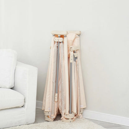 Parc bebe pliant en tissu beige plié